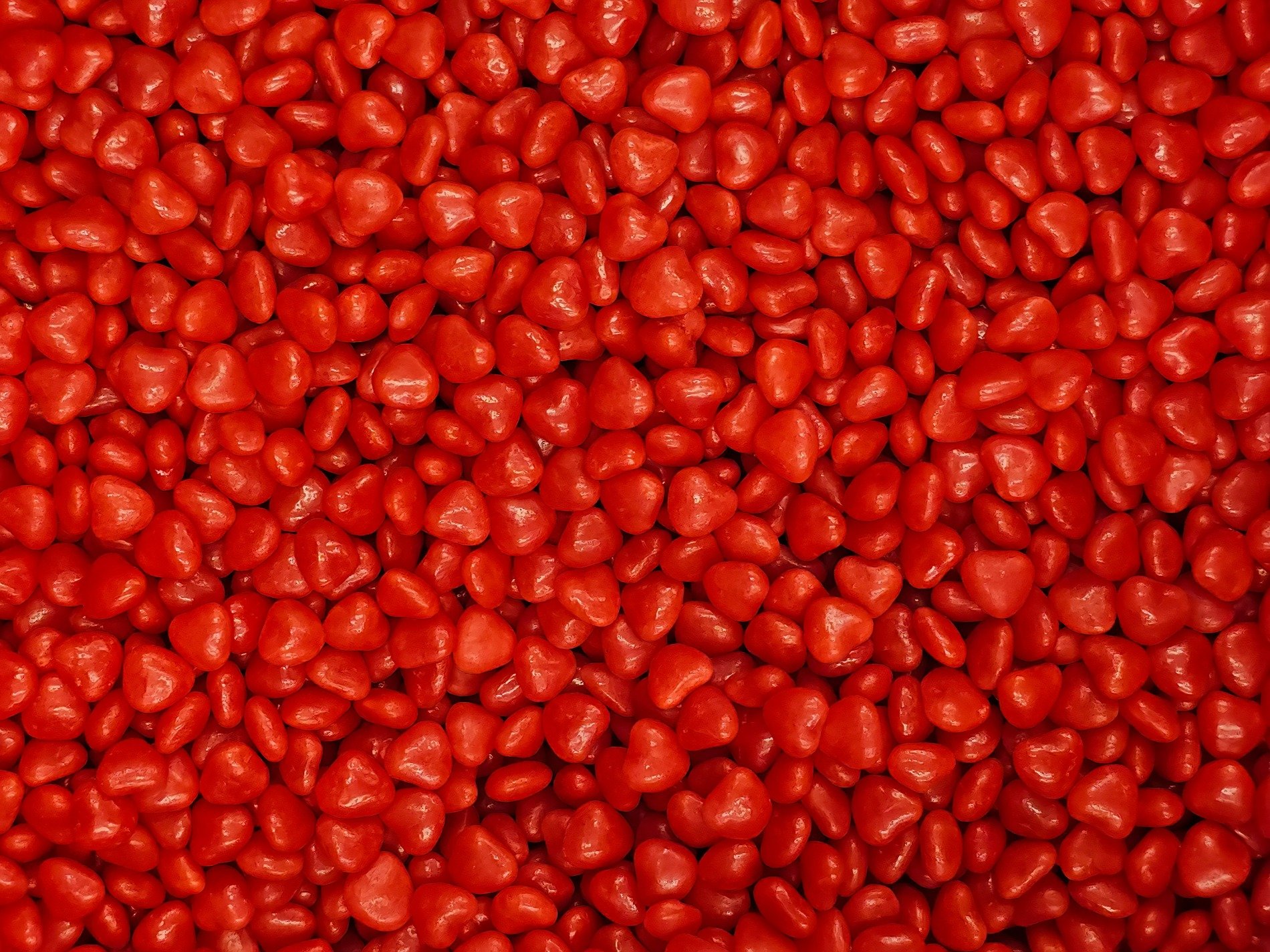 Crimson hearts piled high, sweet cinnamon spice abounds, sea of glowing red