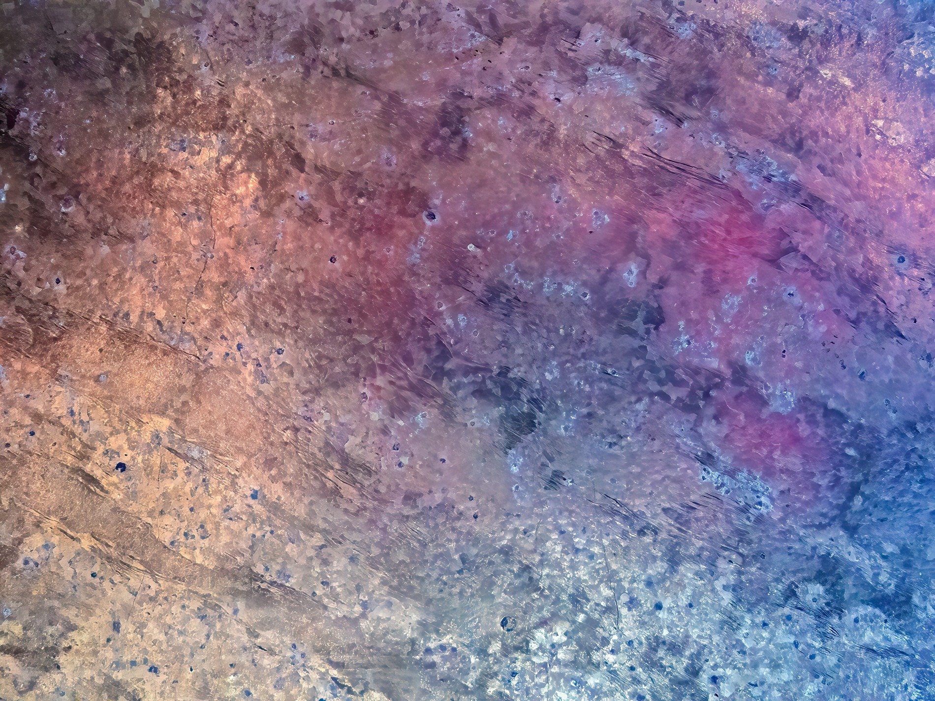 Frozen light trapped deep, colors swirl within the ice, winter's cold embrace