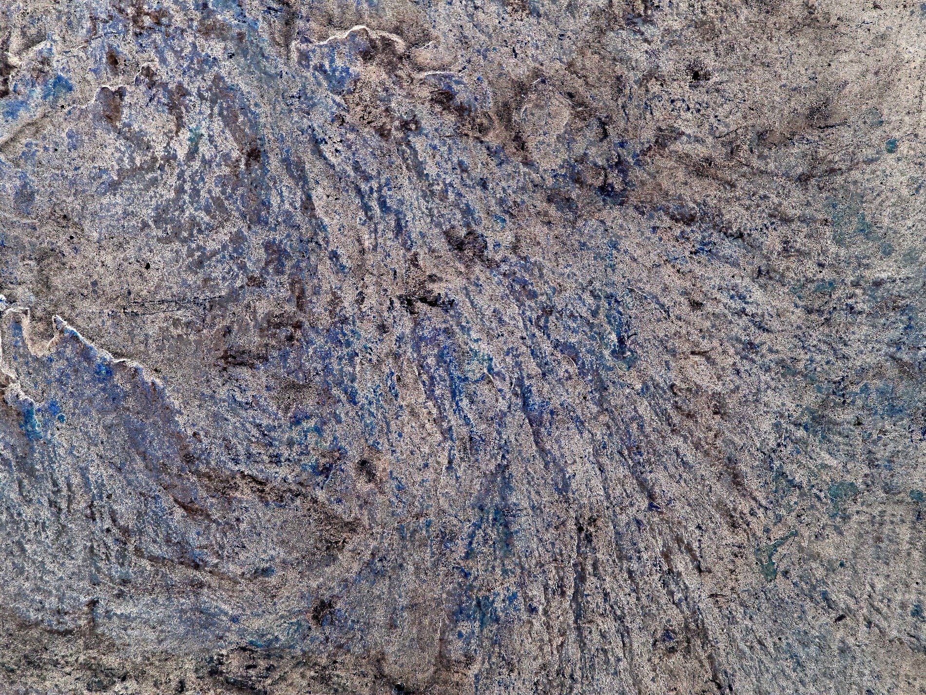 Gray concrete swirls deep, blue shadows stain the rough ground, marks of time remain