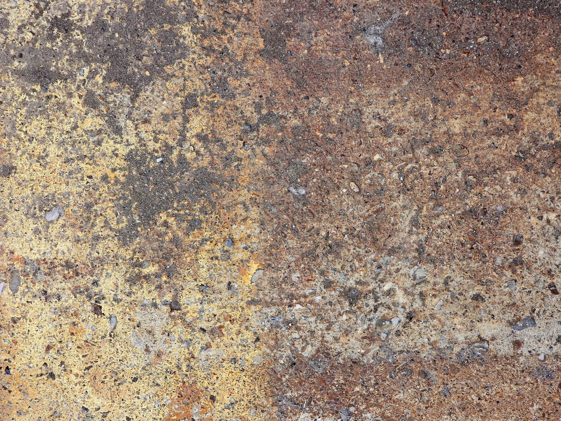Rough stone wears the stain, yellow paint fades into dust, grit tells of the years
