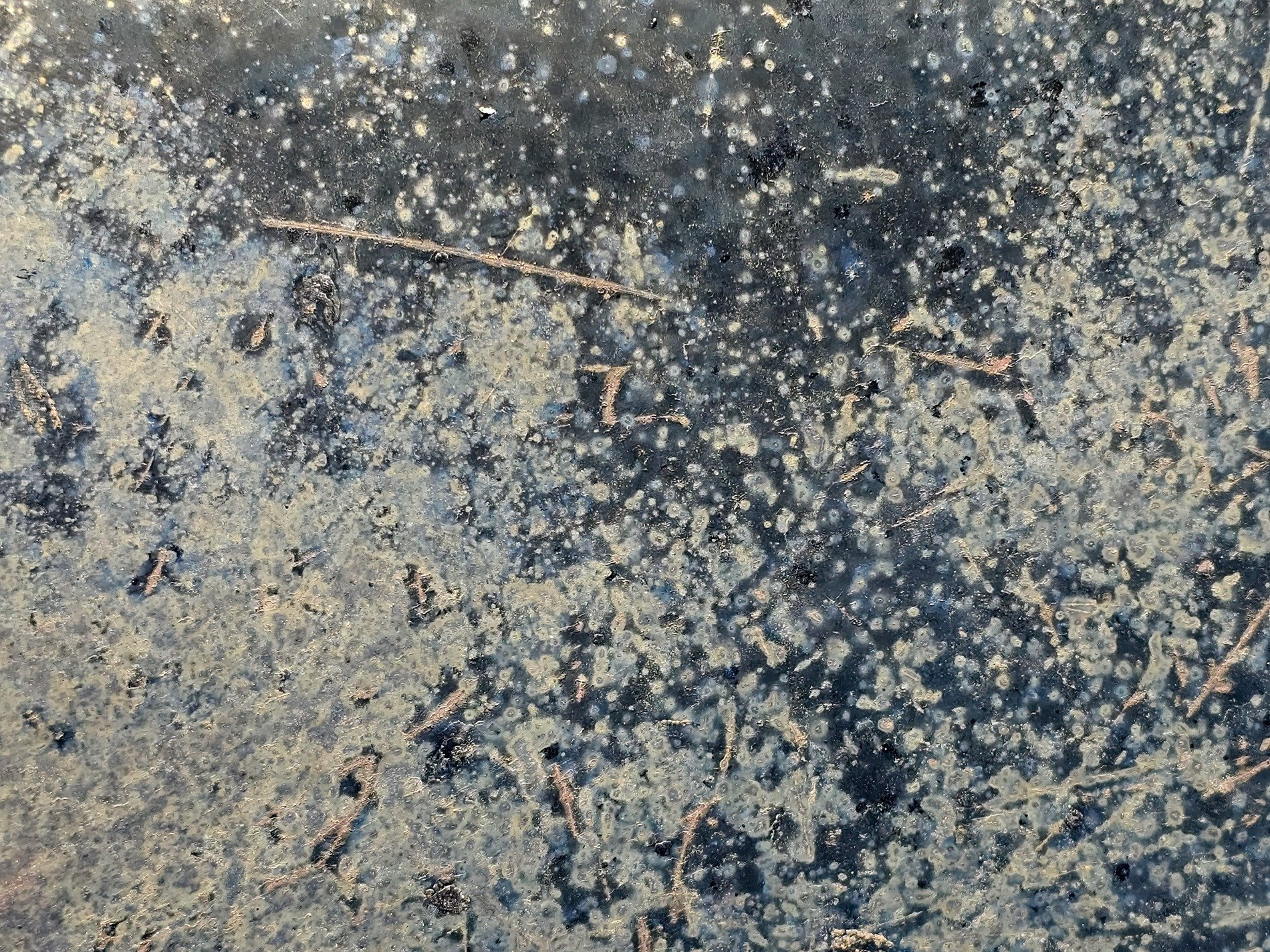 Silver dust settles, dark cold metal holds the scars, cosmic paths etched deep