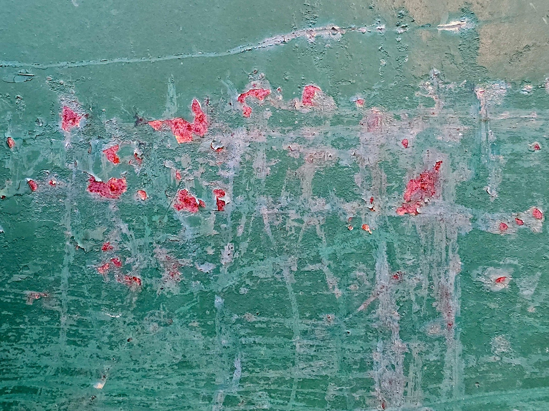 Teal paint starts to peel, rusty wounds bloom on the steel, time chips the surface