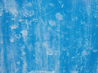 Azure paint stays bright, white stains cloud the surface now, water leaves its mark