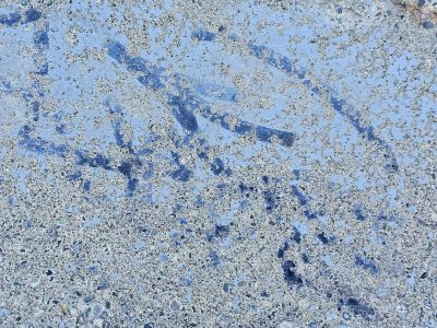Blue paint wears away, rough stone hides beneath the veil, time leaves behind marks