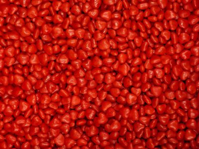 Crimson hearts piled high, sweet cinnamon spice abounds, sea of glowing red