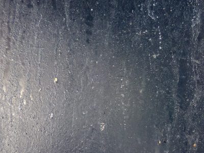 Dark pane holds the mist, silver droplets cling to cold, shadows hide within