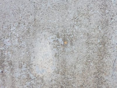 Grey dust settles deep, rough grains touch the open air, solid ground endures