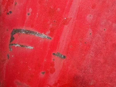 Red field starts to fade, dark scars bite through crimson skin, iron shows its age