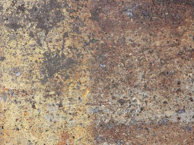 Rough stone wears the stain, yellow paint fades into dust, grit tells of the years