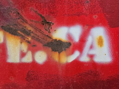 Scarlet paint decays, ghostly letters turn to dust, metal starts to bleed