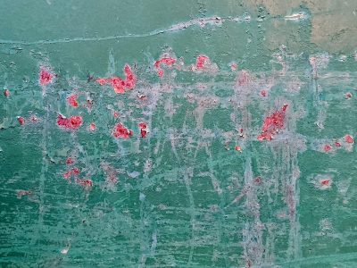 Teal paint starts to peel, rusty wounds bloom on the steel, time chips the surface